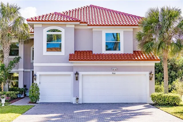 a front view of a house with a garage
