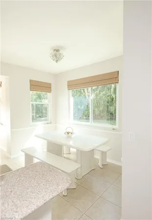 a spacious bathroom with a bathtub and next to a window