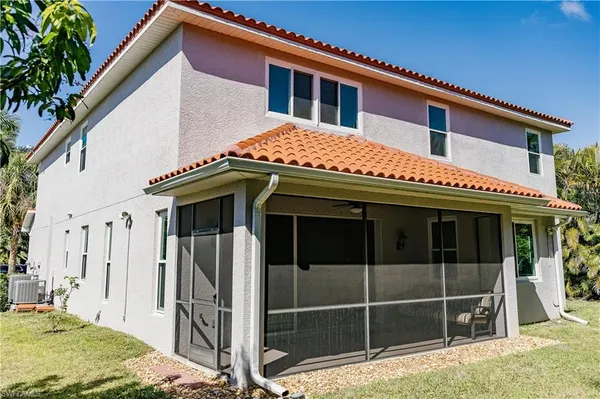 a front view of a house with a large window