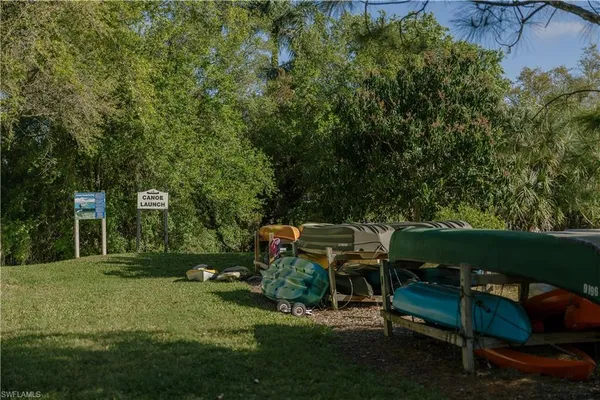 a view of a backyard with sitting area