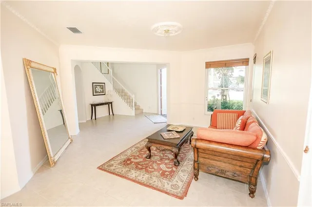 a living room with furniture and a rug