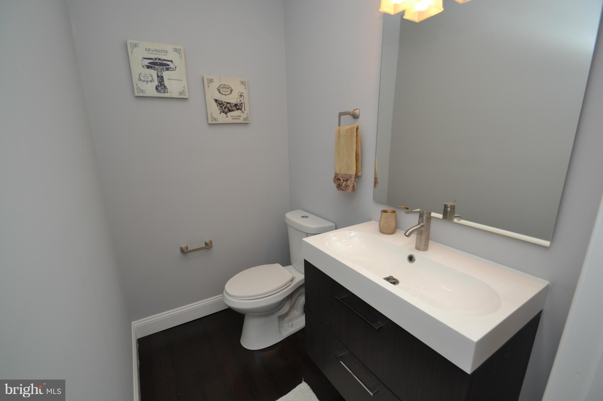 3810 Ridgecroft Road Baltimore, MD 21206 - Photo 13 of 30 a bathroom with a sink and a toilet