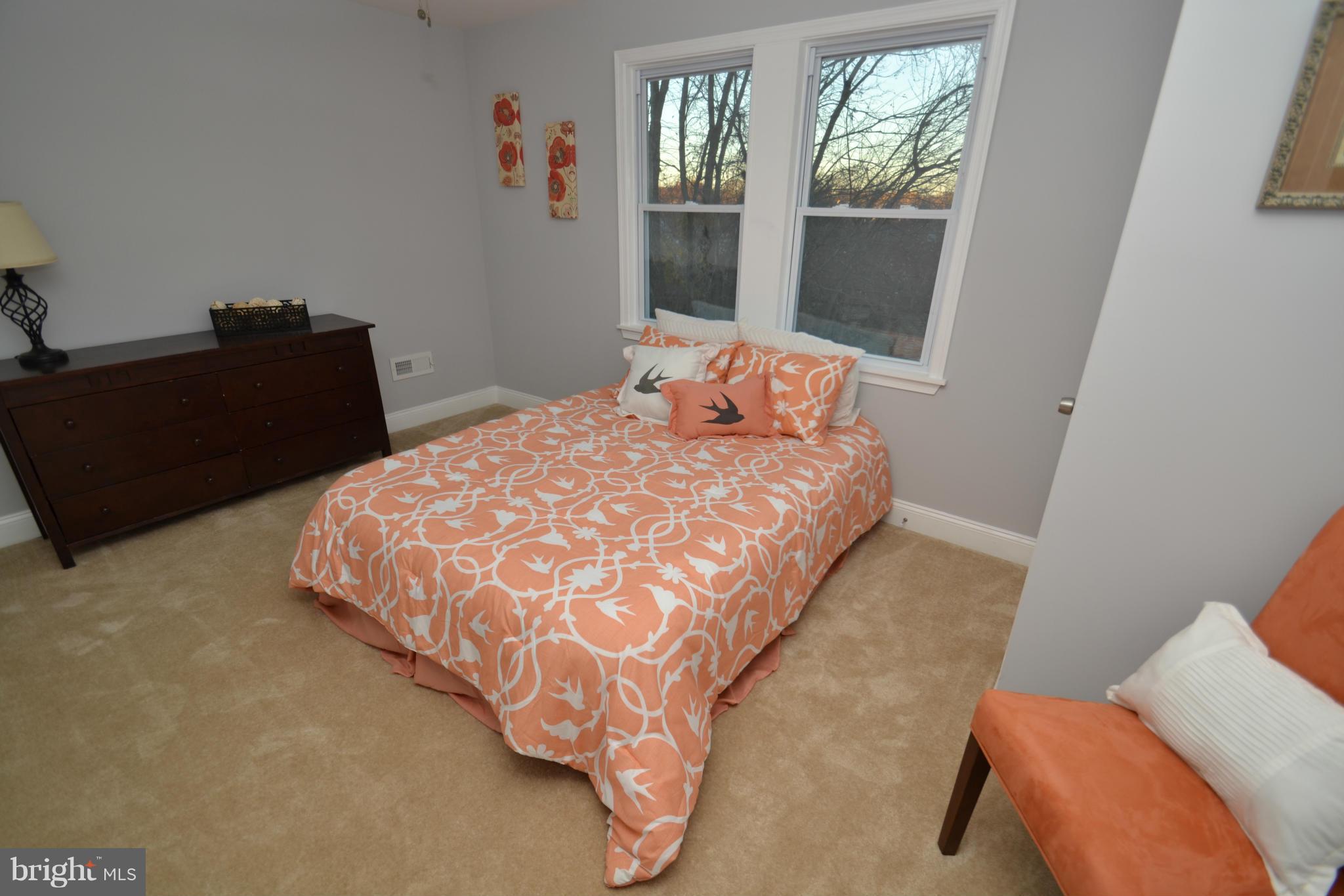 3810 Ridgecroft Road Baltimore, MD 21206 - Photo 15 of 30 a bedroom with a bed and window
