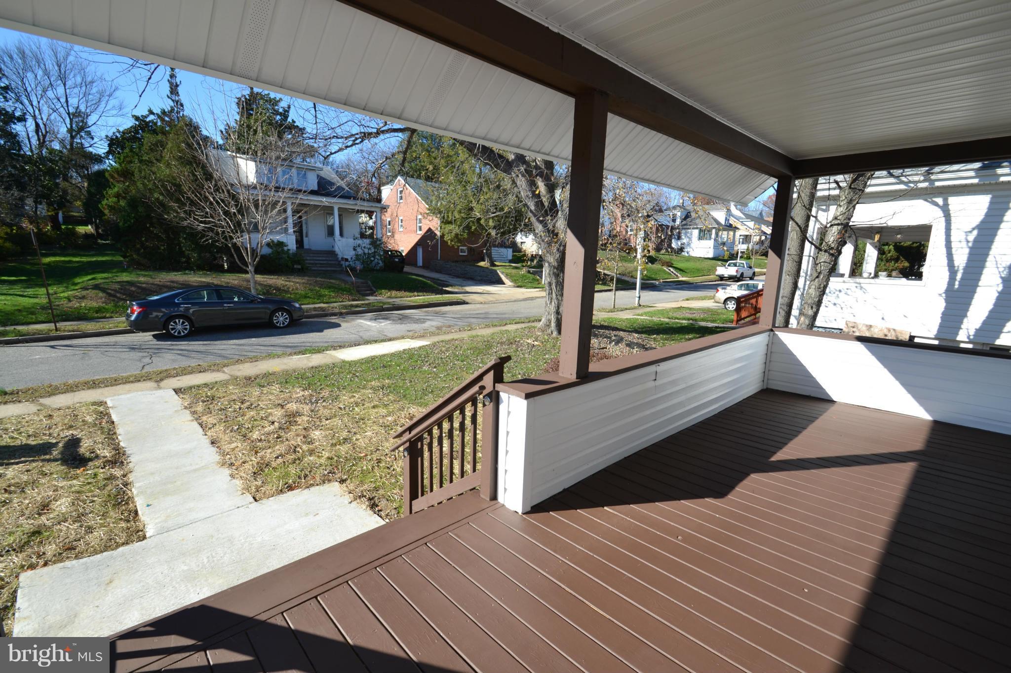 3810 Ridgecroft Road Baltimore, MD 21206 - Photo 3 of 30 a view of balcony with couch and wooden floor