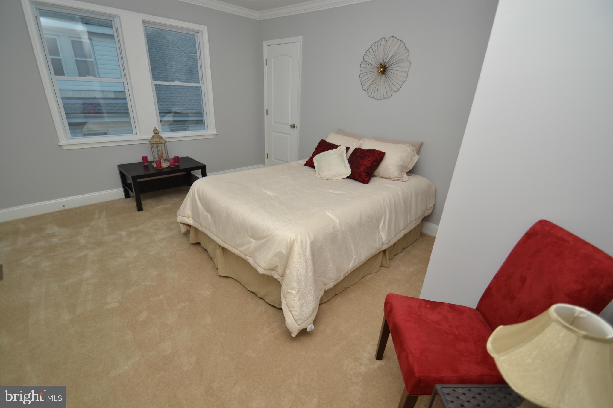 3810 Ridgecroft Road Baltimore, MD 21206 - Photo 23 of 30 a bedroom with a bed and window