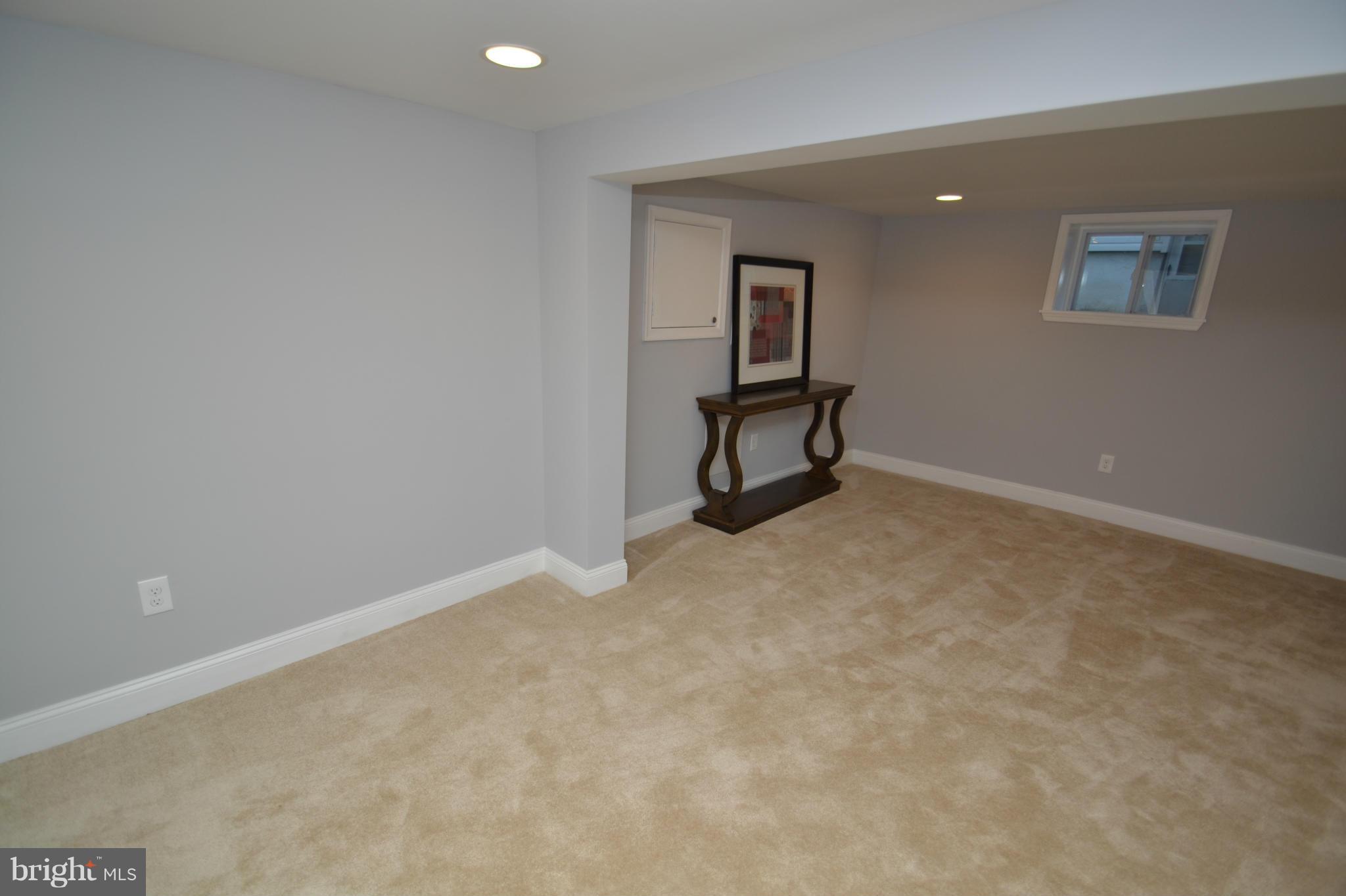3810 Ridgecroft Road Baltimore, MD 21206 - Photo 27 of 30 an empty room with windows and mirror