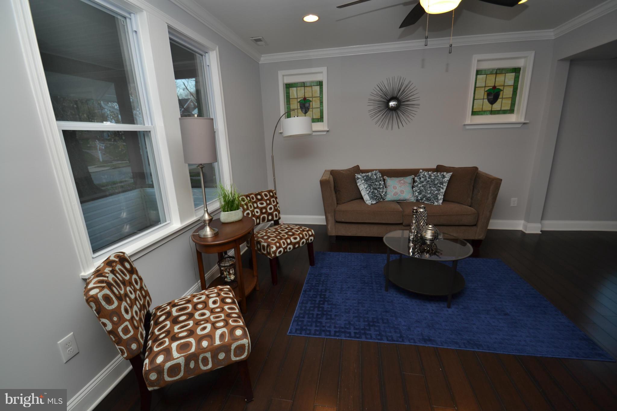 3810 Ridgecroft Road Baltimore, MD 21206 - Photo 6 of 30 a living room with furniture and wooden floor
