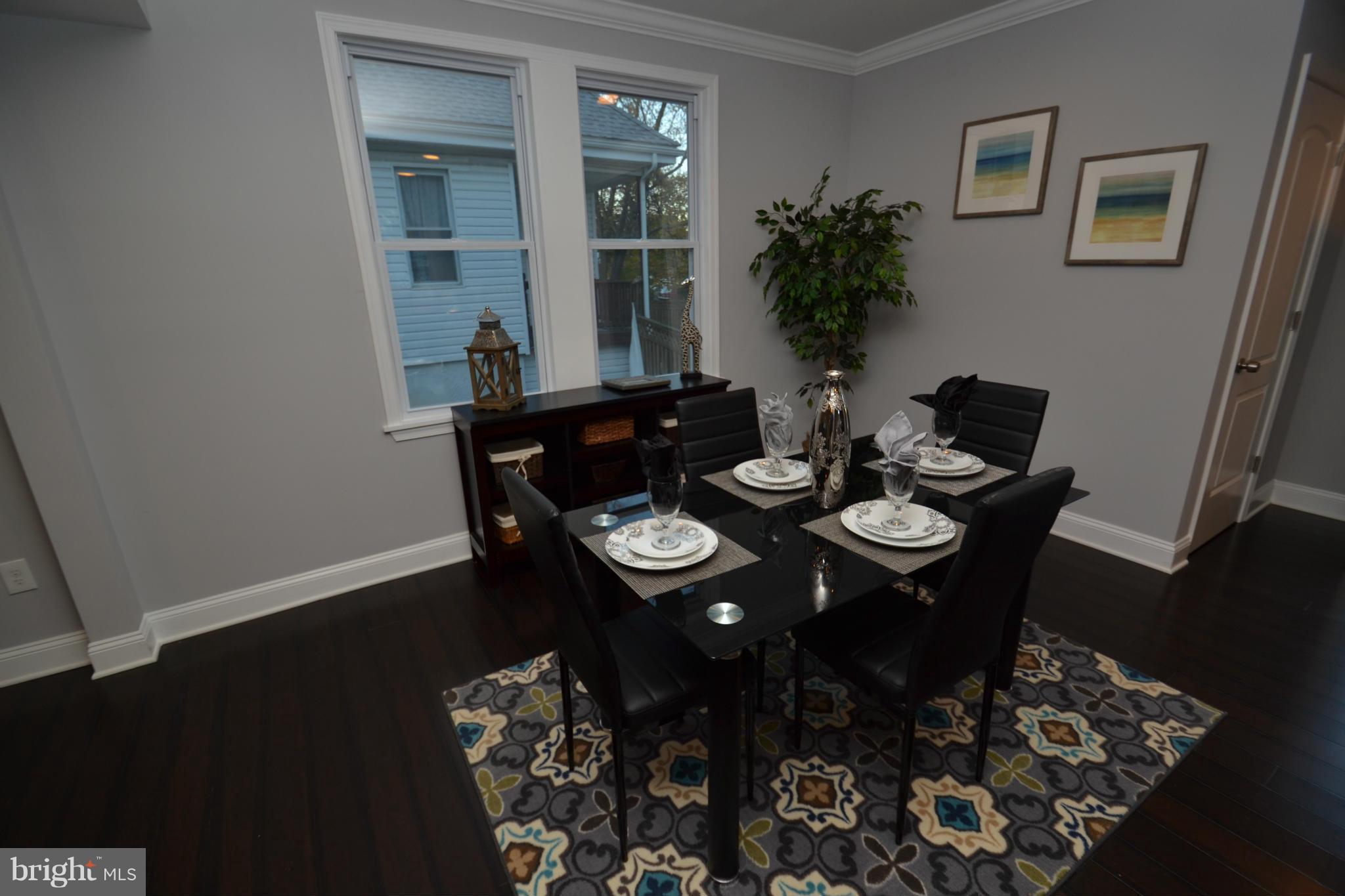 3810 Ridgecroft Road Baltimore, MD 21206 - Photo 8 of 30 a view of a dining room with furniture and wooden floor