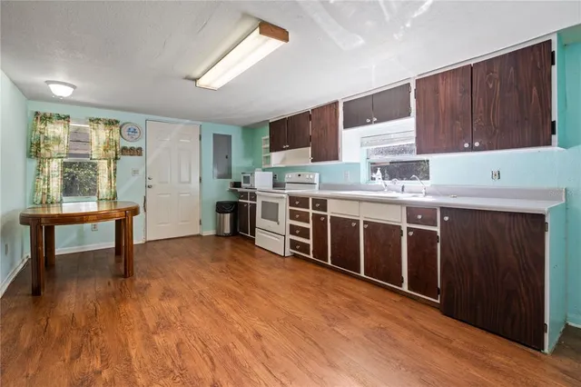 a kitchen with a stove and a refrigerator