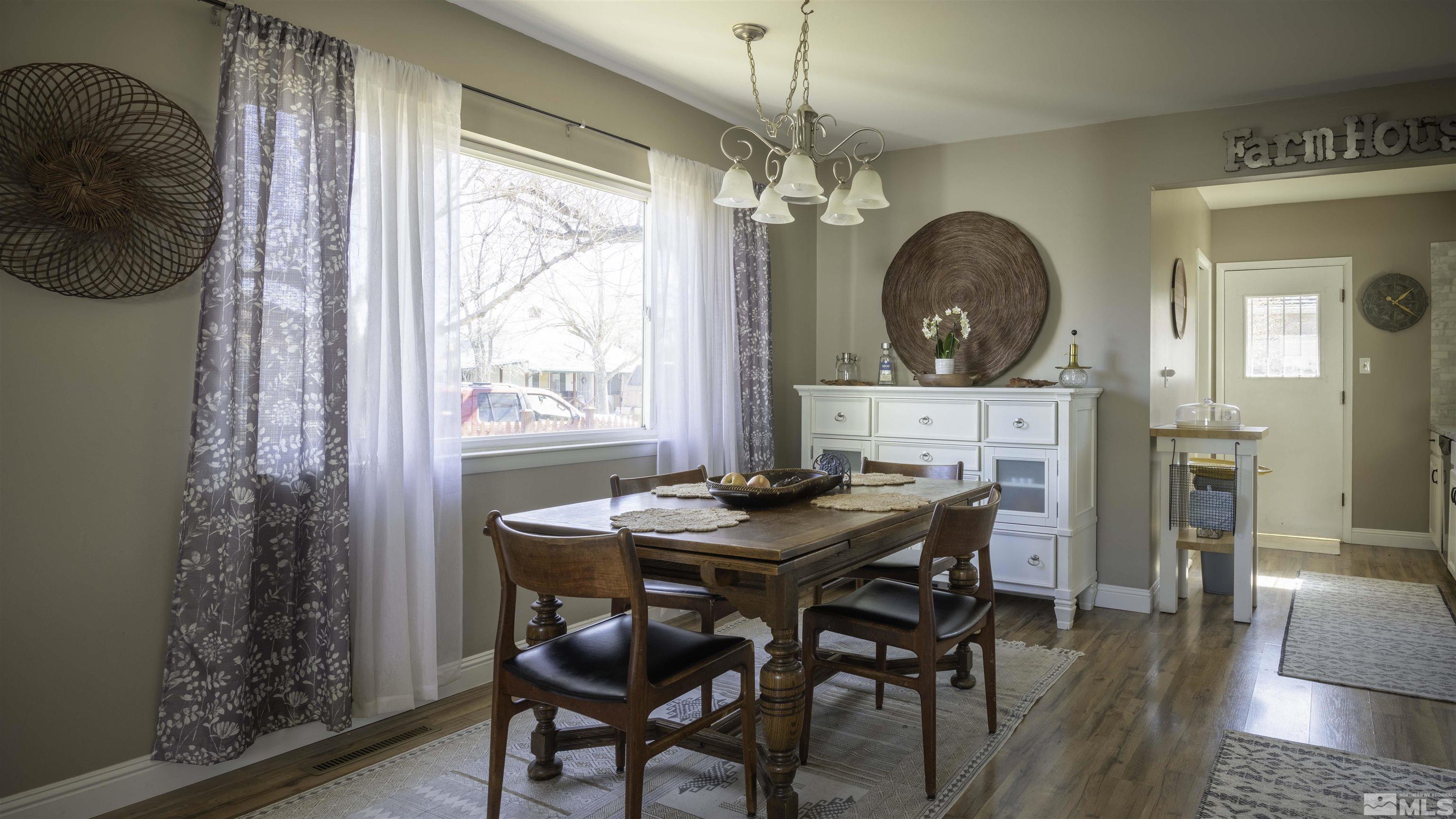 718 Balzar Circle Reno, NV 89502 - Photo 8 of 20 a view of a dining room with furniture window and wooden floor