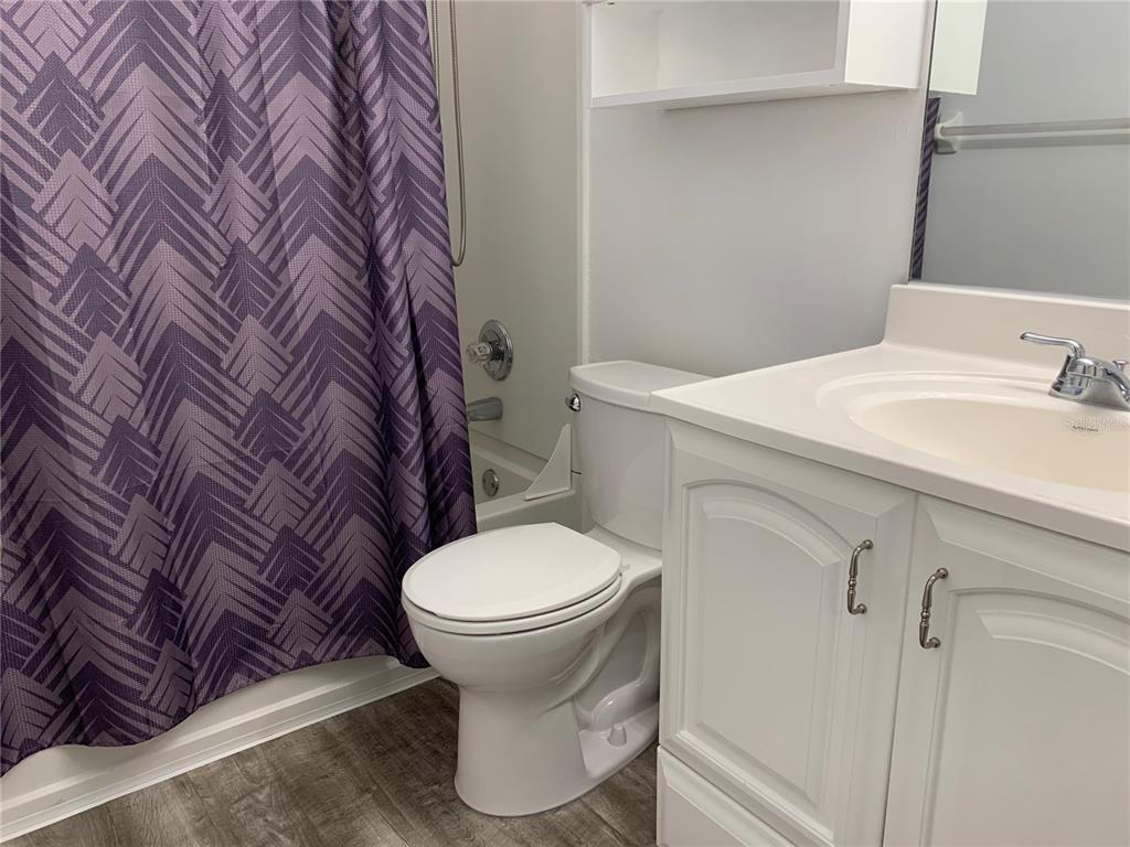 5754 Southwest 8th Place Gainesville, FL 32607 - Photo 20 of 29 a bathroom with a sink and toilet