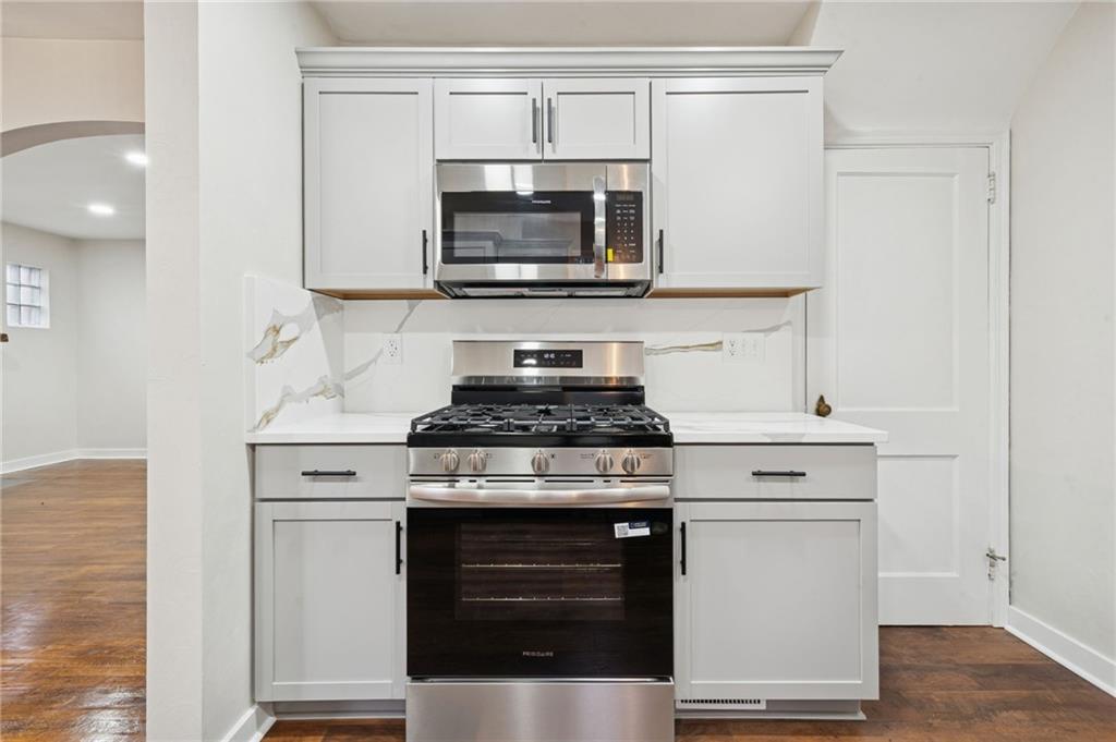 601 Milltown Road New Kensington, PA 15068 - Photo 13 of 36 a kitchen with stainless steel appliances granite countertop a stove and a microwave