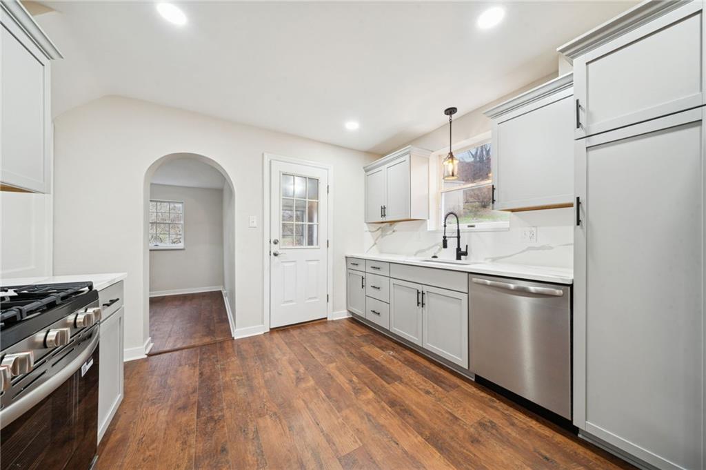 601 Milltown Road New Kensington, PA 15068 - Photo 16 of 36 a kitchen with stainless steel appliances granite countertop a sink stove and refrigerator