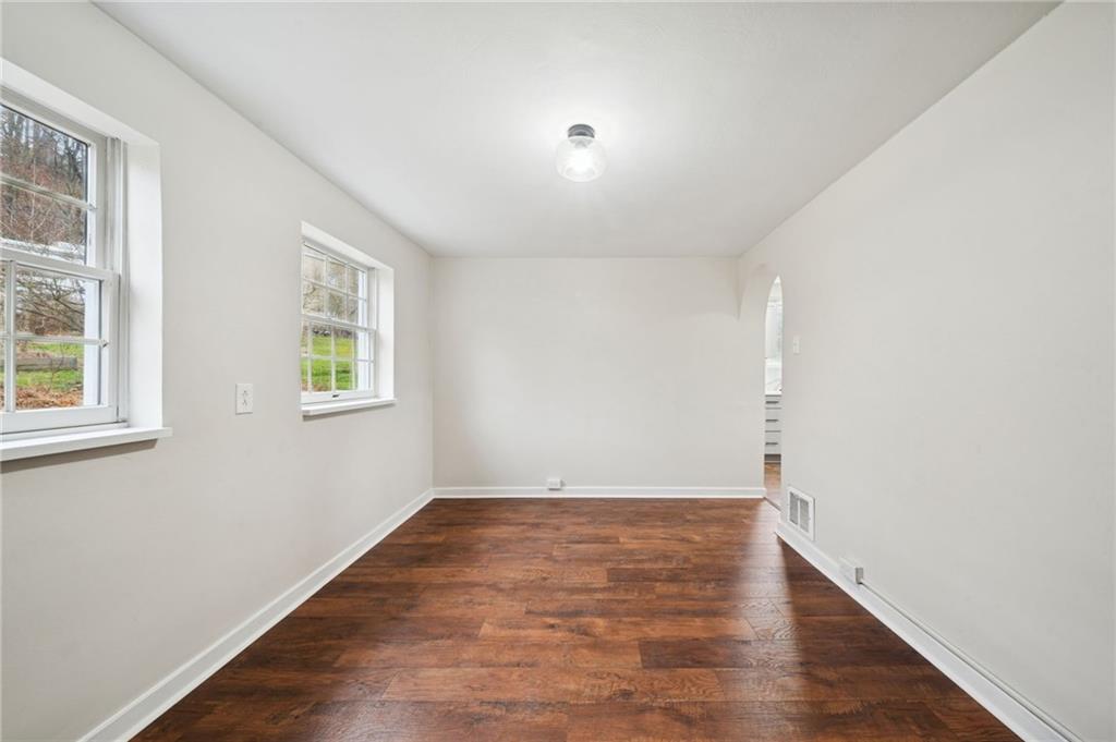 601 Milltown Road New Kensington, PA 15068 - Photo 20 of 36 an empty room with wooden floor and windows