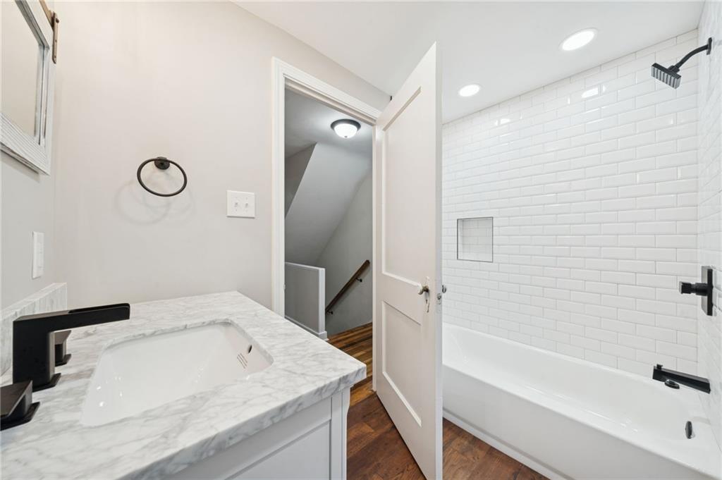 601 Milltown Road New Kensington, PA 15068 - Photo 23 of 36 a bathroom with a tub sink and a mirror