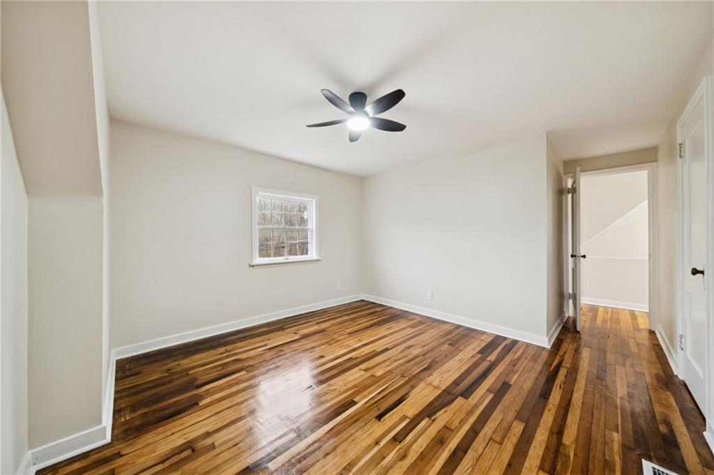 601 Milltown Road New Kensington, PA 15068 - Photo 24 of 36 a view of a room with wooden floor and a ceiling fan