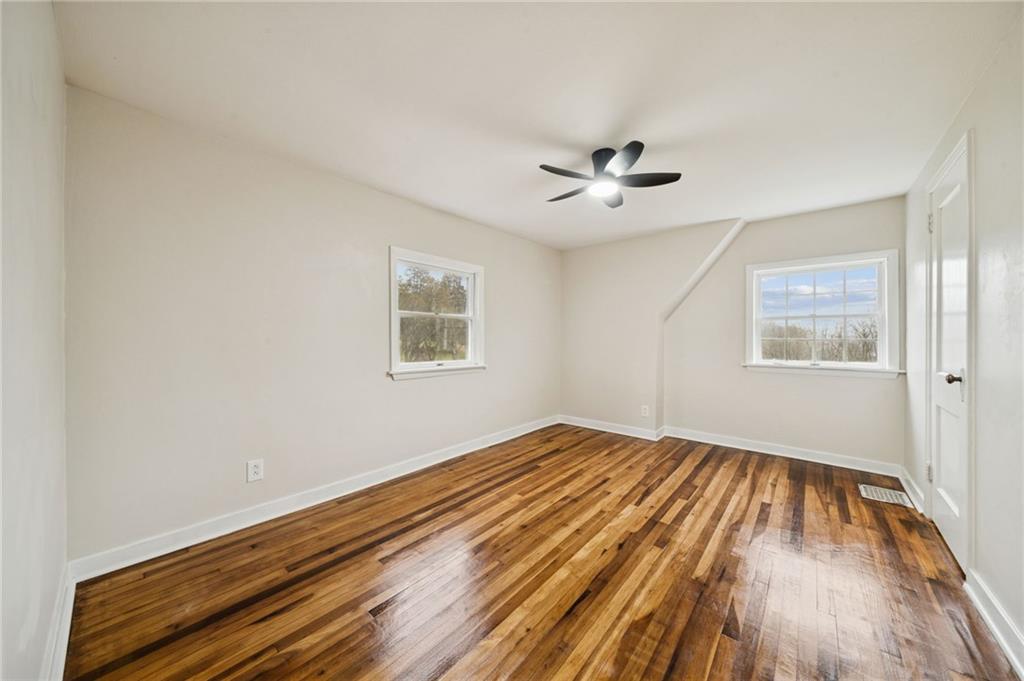 601 Milltown Road New Kensington, PA 15068 - Photo 28 of 36 a view of empty room with wooden floor and fan