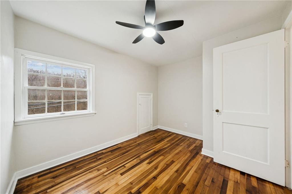 601 Milltown Road New Kensington, PA 15068 - Photo 32 of 36 a view of a room with wooden floor and a ceiling fan