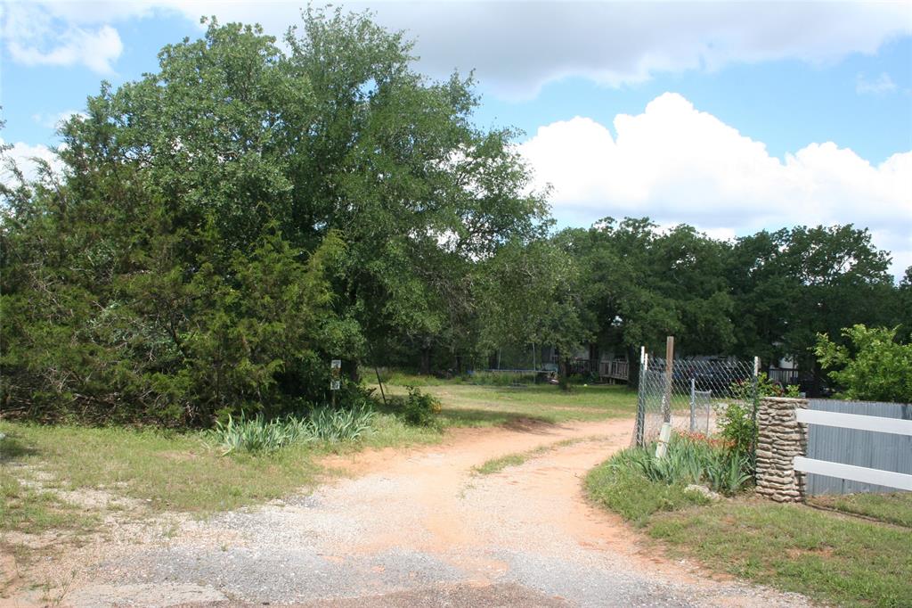 215 A Buzbee Road Palo Pinto, TX 76484 - Photo 6 of 7 a view of backyard with green space