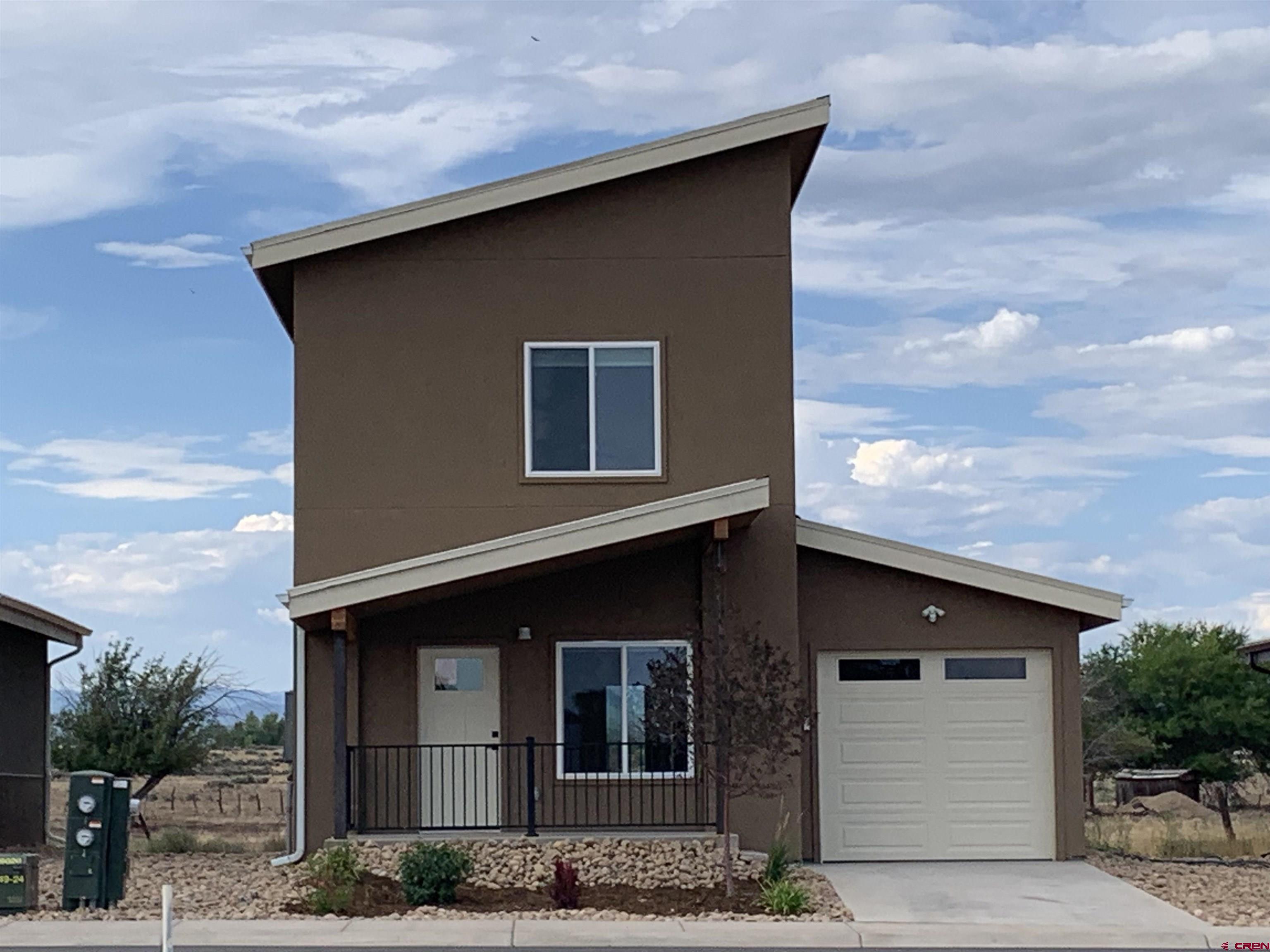 210 Manzano Circle Ignacio, CO 81137 - Photo 2 of 10 a front view of a house