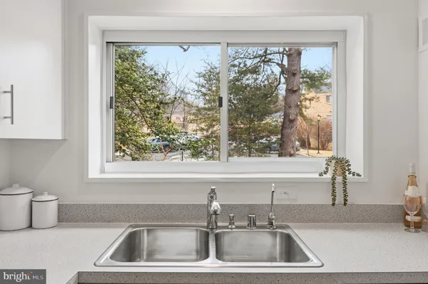 a kitchen with a sink and a window