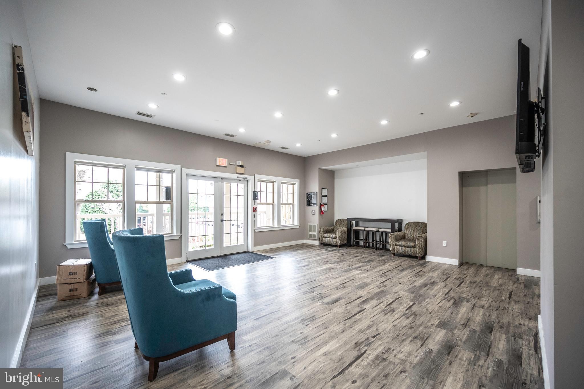 1725 Ascot Way, Unit 1725I Reston, VA 20190 - Photo 32 of 48 COMMUNITY CENTER GREAT ROOM 1