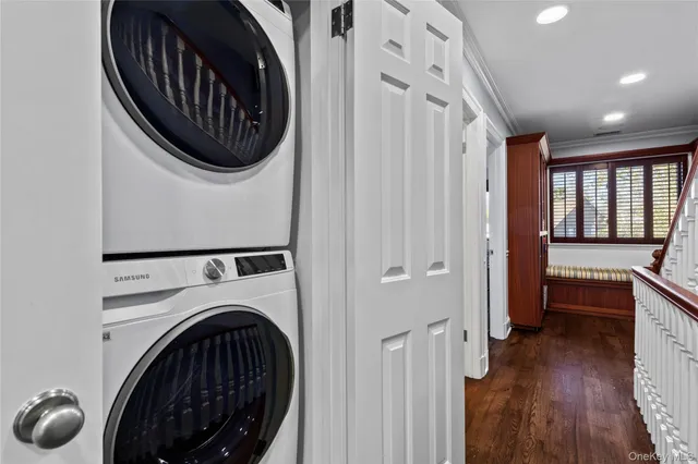 a view of a hallway with washer and dryer