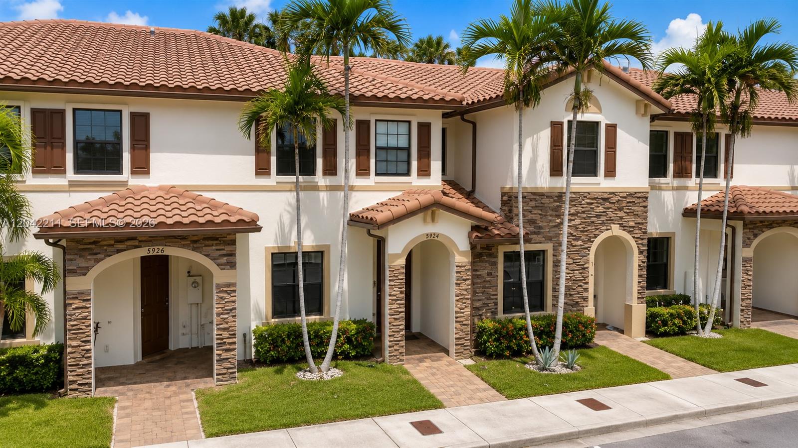 8954 West 35th Way Hialeah, FL 33018 - Photo 2 of 24 a front view of a house with garden
