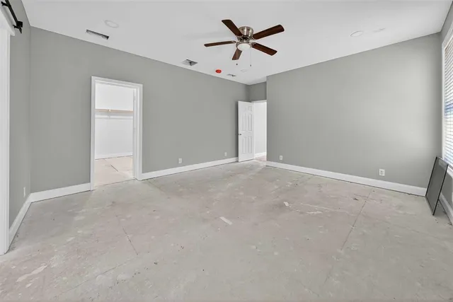 a view of a livingroom with a ceiling fan and a window