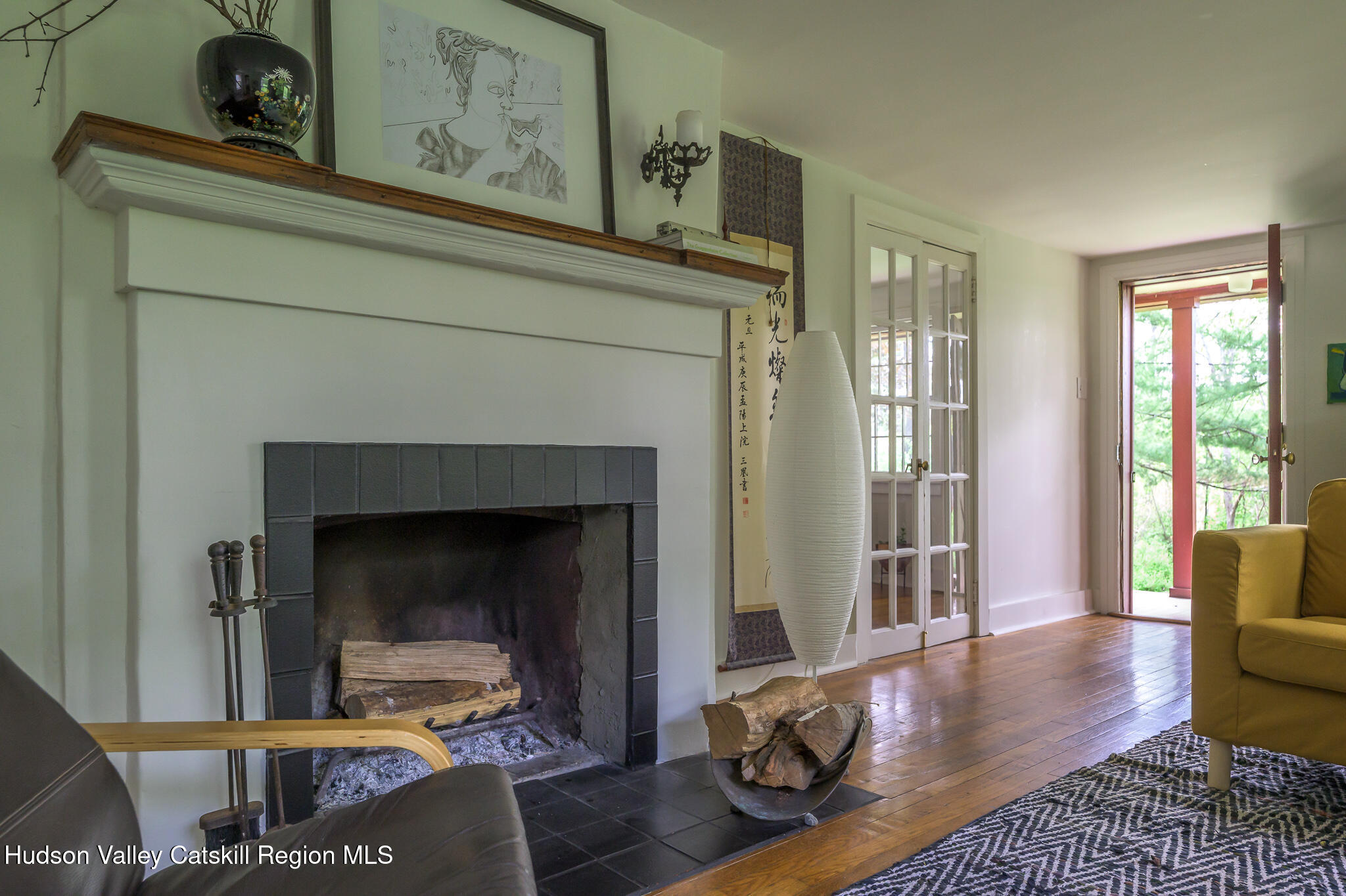 1963 County Rte 5 Canaan, NY 12029 - Photo 21 of 46 a living room with furniture and a fireplace
