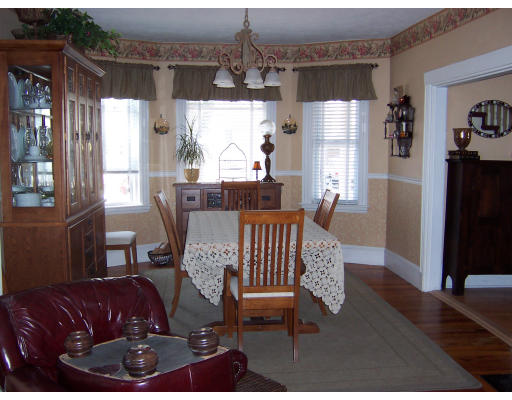 41 Baker Road Everett, MA 02149 - Photo 3 of 9 a view of a dining room with furniture window and wooden floor