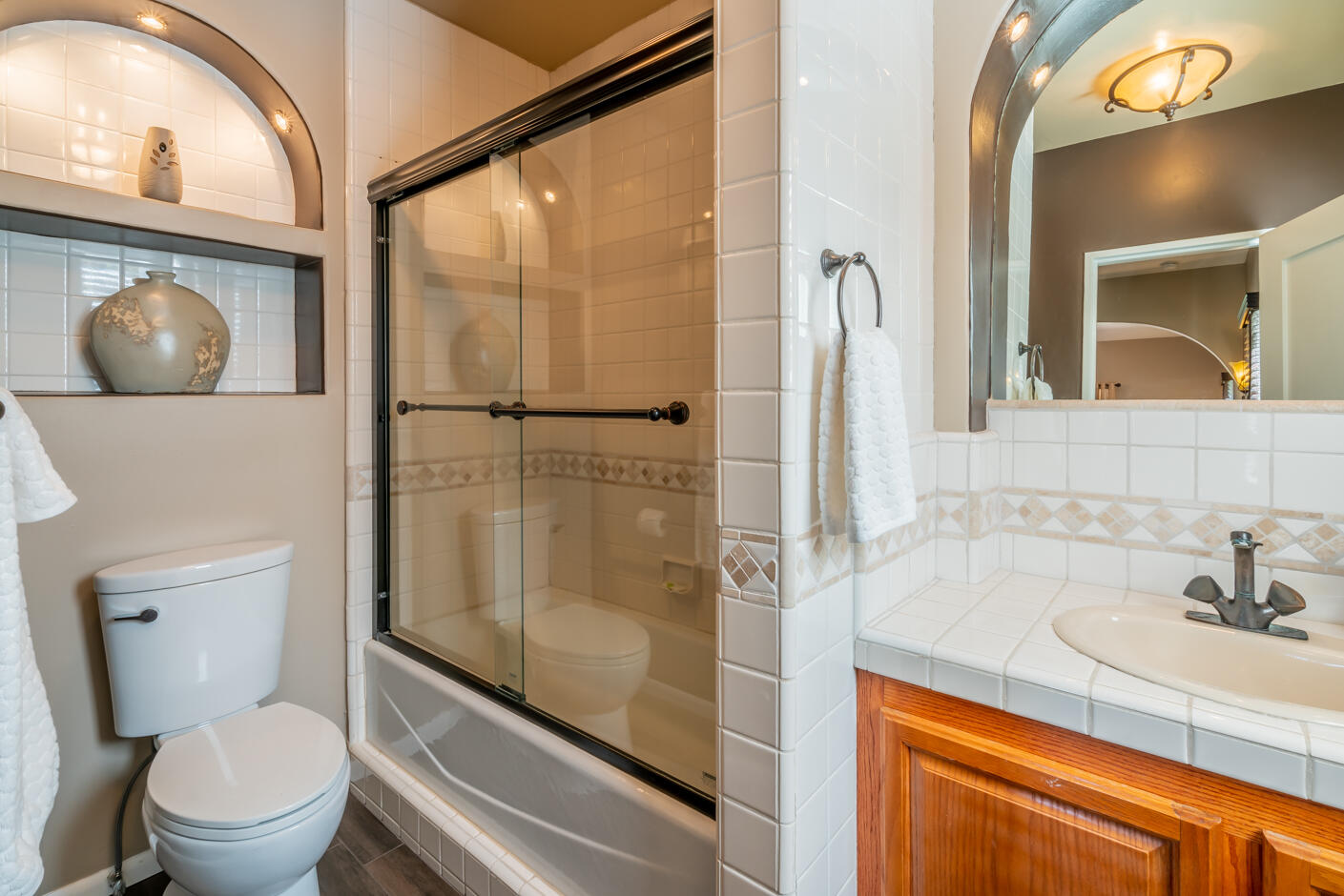 511 Drexel Drive Santa Barbara, CA 93103 - Photo 17 of 27 a bathroom with a granite countertop sink toilet and shower