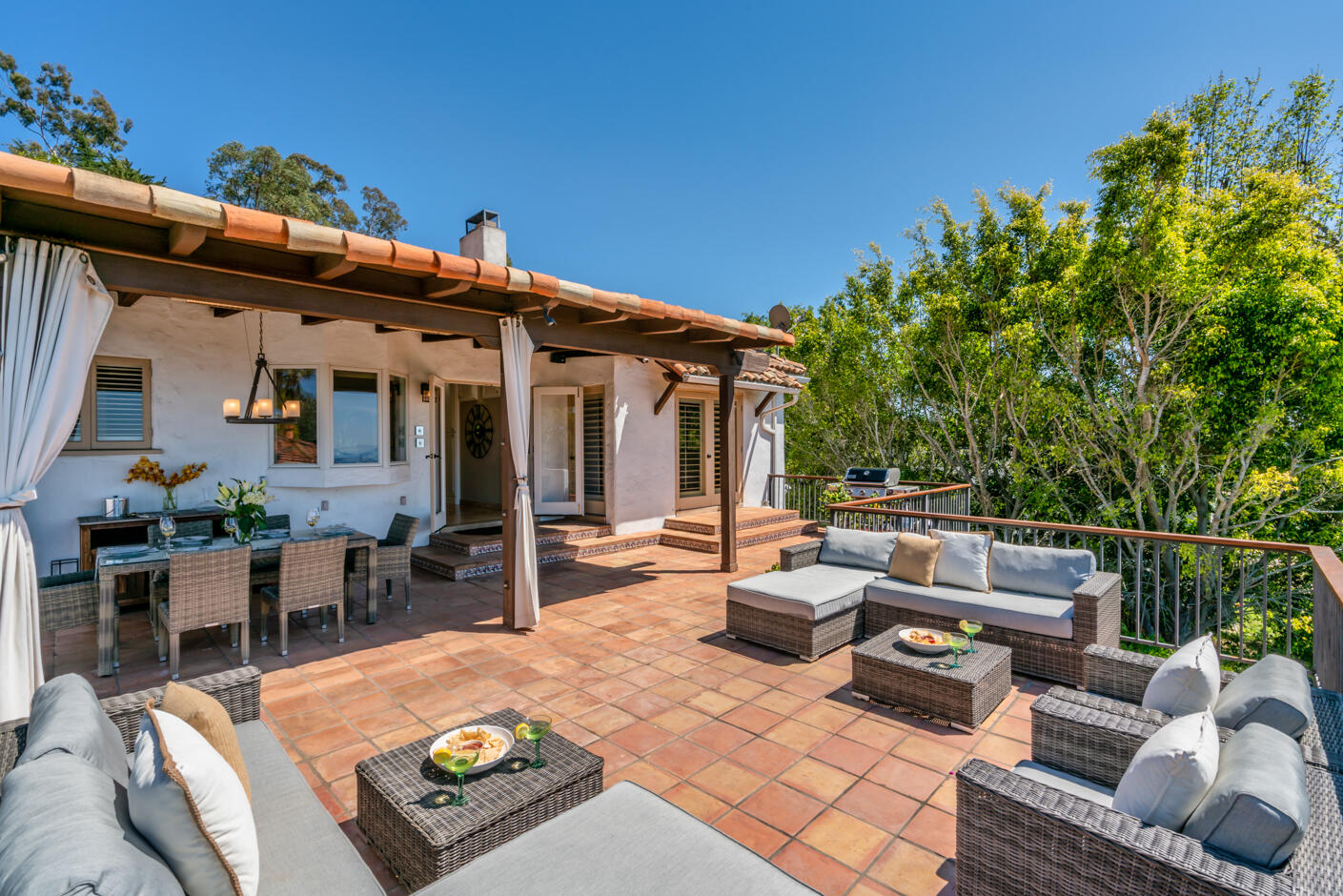 511 Drexel Drive Santa Barbara, CA 93103 - Photo 10 of 27 a view of a patio with couches table and chairs and potted plants