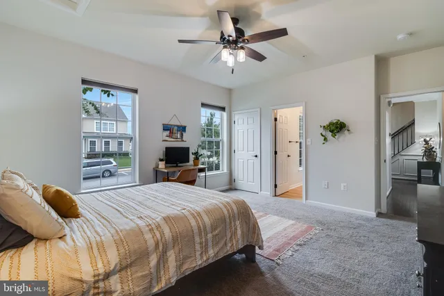 a view of a hallway with dining area