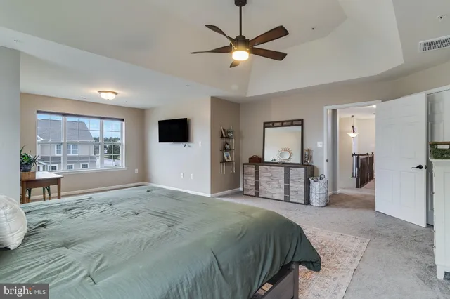 a bedroom with a bed and a table