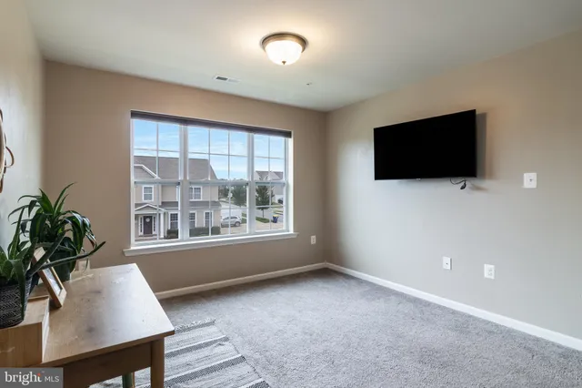 a bathroom with double vanity sinks and a mirror