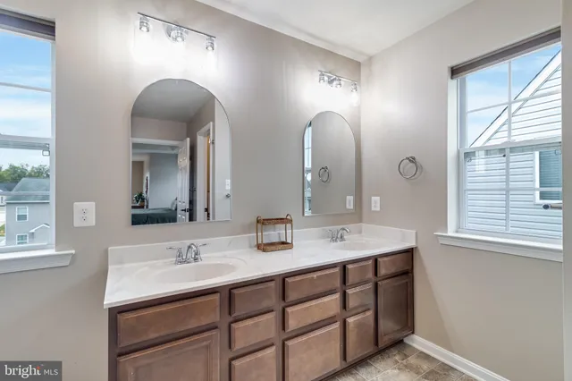 a spacious bedroom with a bed and a table