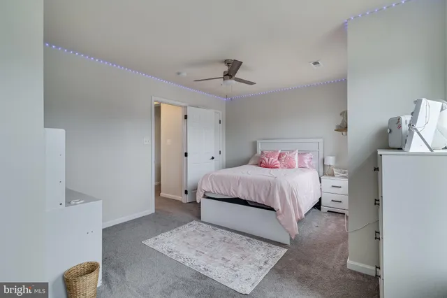 a view of a livingroom with workspace and a window