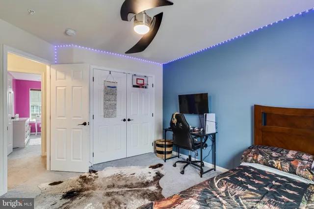 a view of a room with workspace and a window