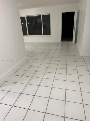 a bathroom with a toilet and shower