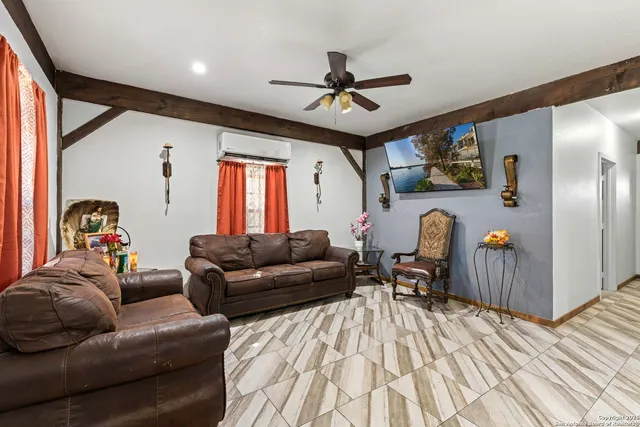 a bed sitting in a bedroom next to a lamp