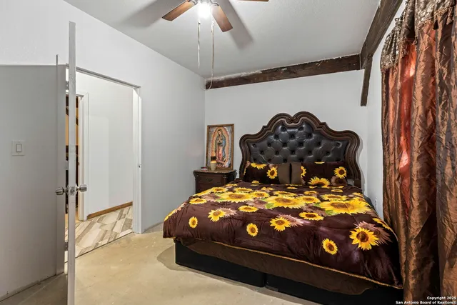 a bedroom with a bed and a window