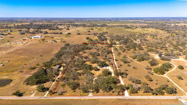an aerial view of residential space with beach