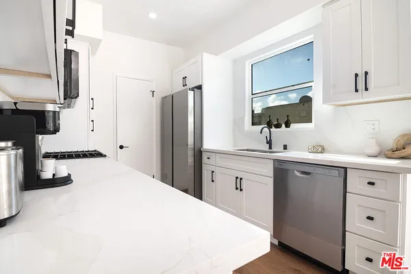 a bathroom with a toilet a sink and a mirror