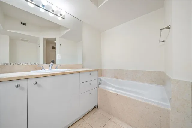 a spacious bathroom with a double vanity sink mirror and