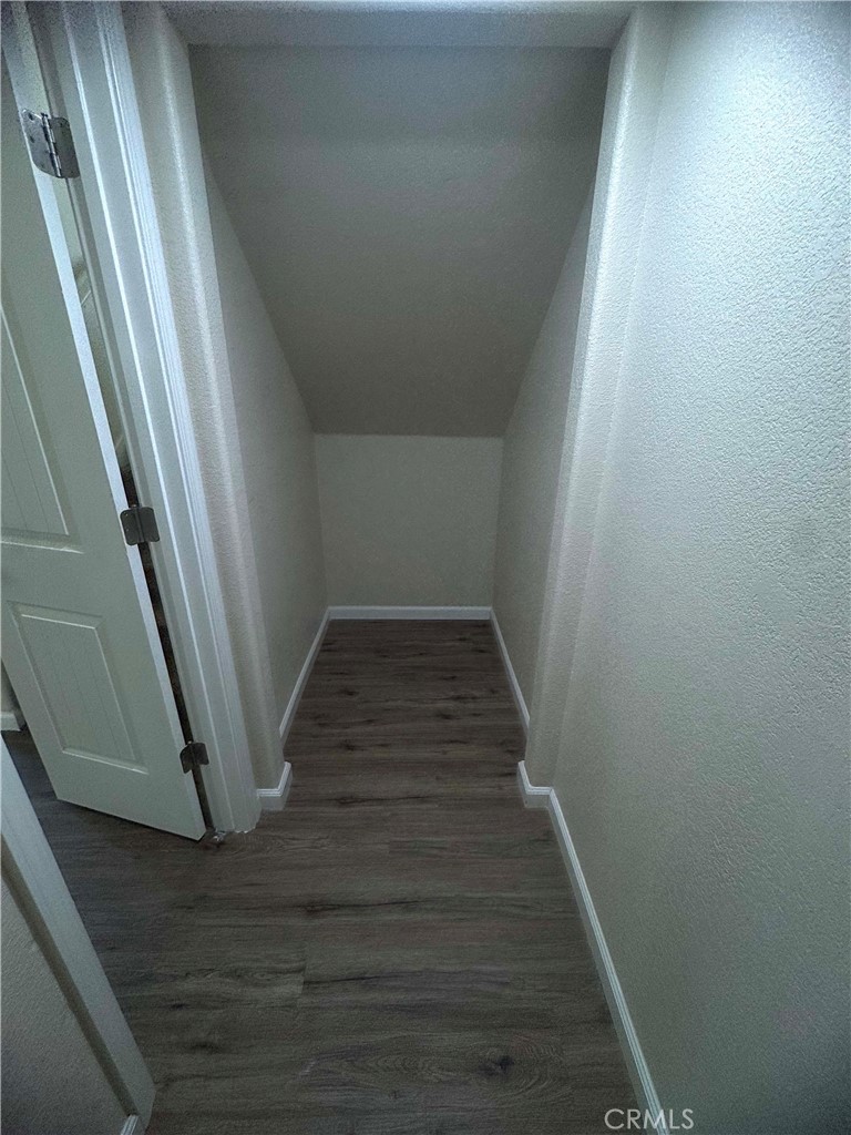 1339 Playa Del Rey Drive Merced, CA 95348 - Photo 14 of 48 a view of a hallway with wooden floor and staircase