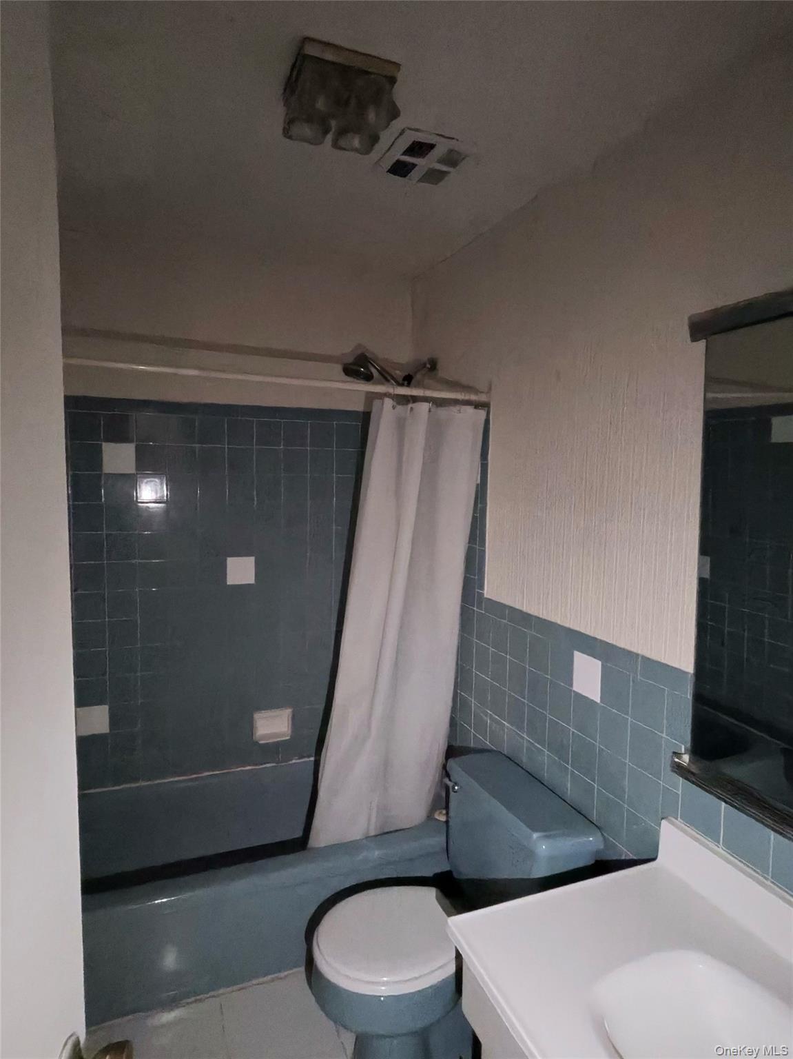 285 Sneden Place West, Unit 285 Spring Valley, NY 10977 - Photo 3 of 7 a bathroom with a toilet and a shower