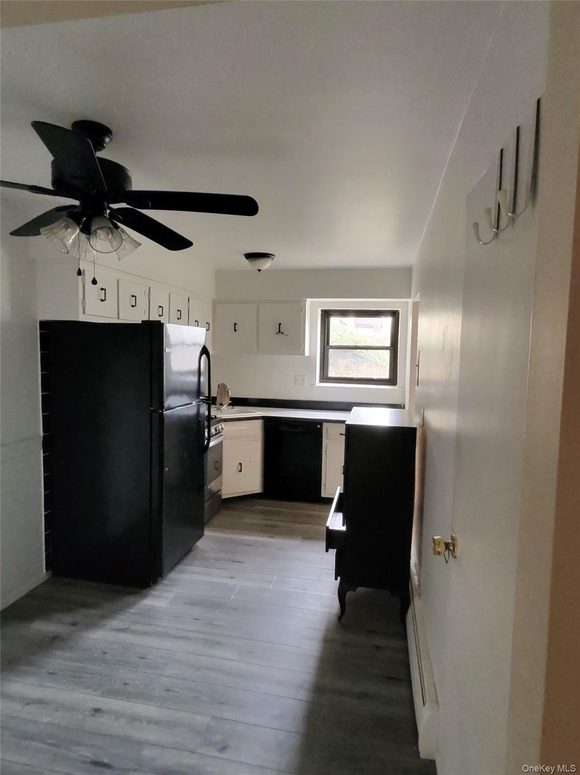 285 Sneden Place West, Unit 285 Spring Valley, NY 10977 - Photo 4 of 7 a kitchen with stainless steel appliances a refrigerator and a stove top oven