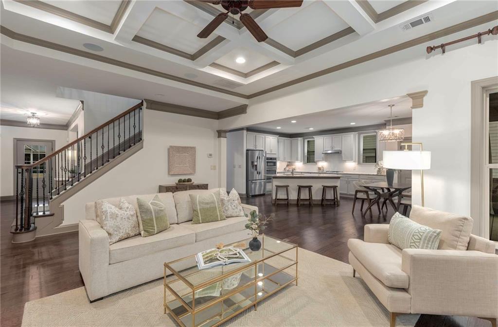 6715 Bentley Ridge Drive Cumming, GA 30040 - Photo 1 of 1 a living room with furniture and a table