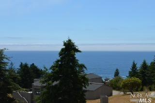 372 Spring Meadow The Sea Ranch, CA 95497 - Photo 1 of 1 a view of a lake and mountain in the back